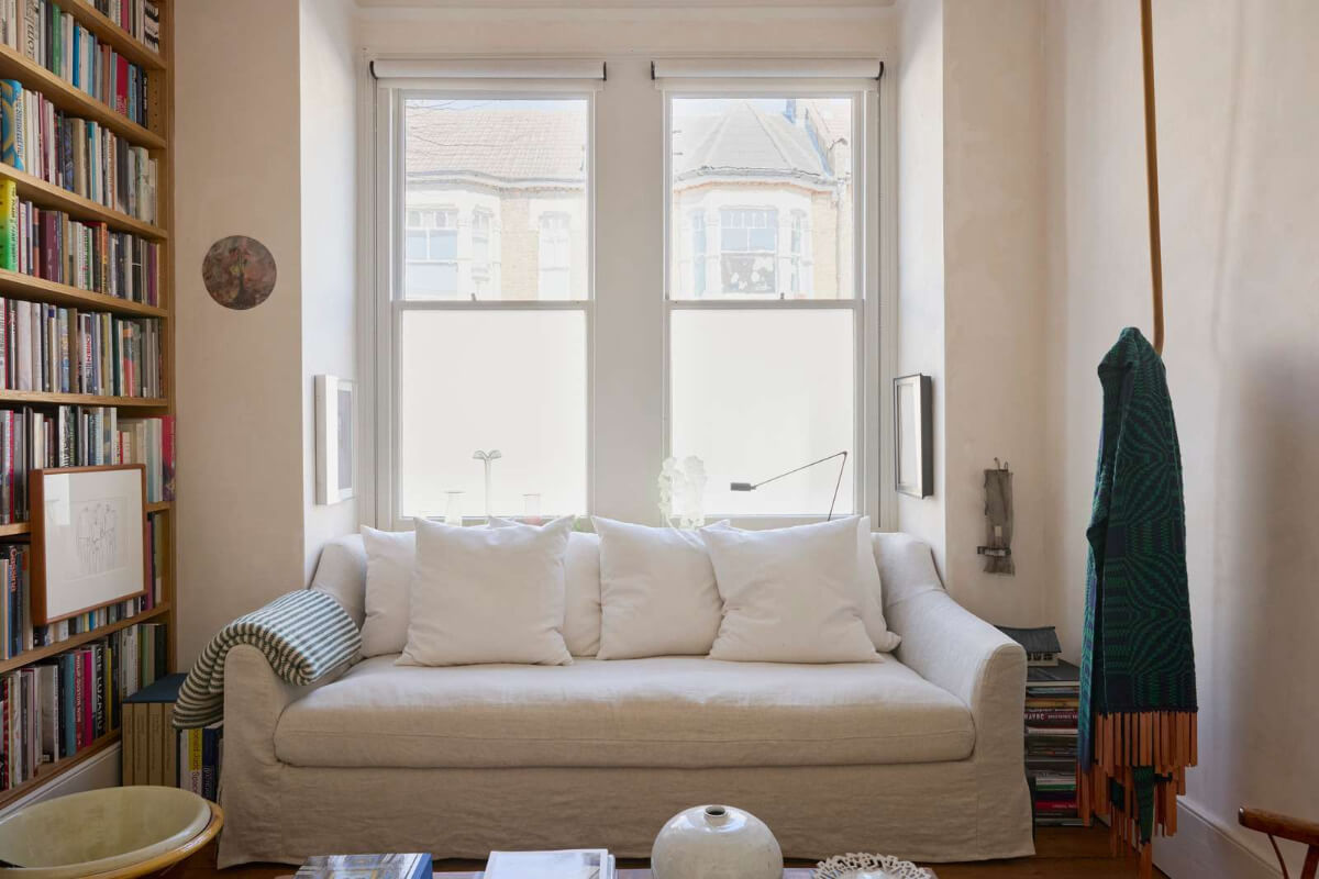 Bespoke Oak Cabinets and Plaster Walls in a London Garden Apartment 2 small living room floor-to-ceiling bookshelves