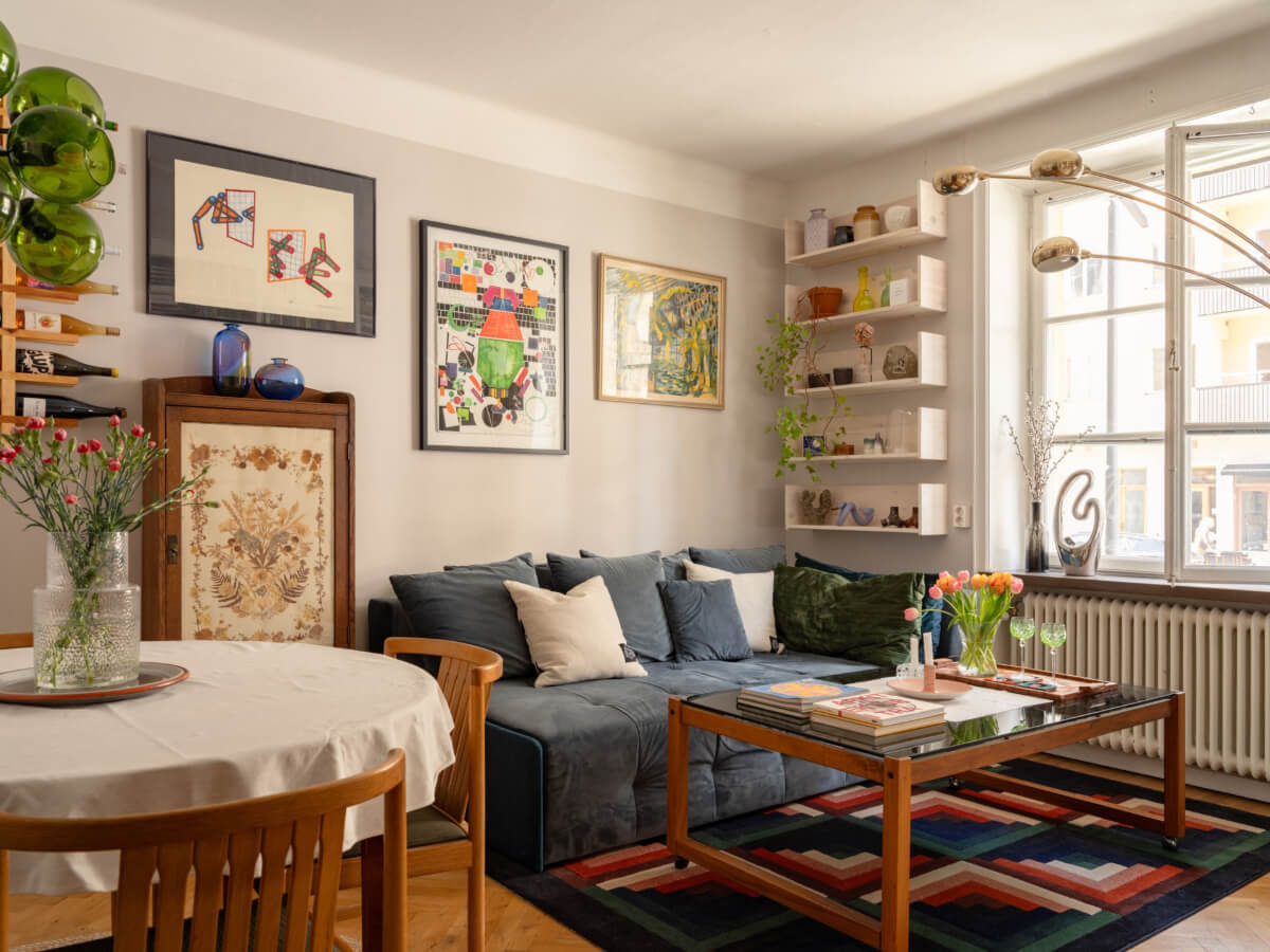 A Small, Cozy Apartment with Built-in Storage and Bookshelves 1 small living room with shelves