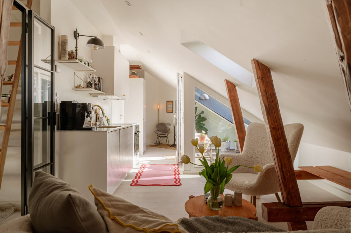 A Bright Attic Apartment with Exposed Beams and a Roof Terrace 1 small white attic apartment exposed beams