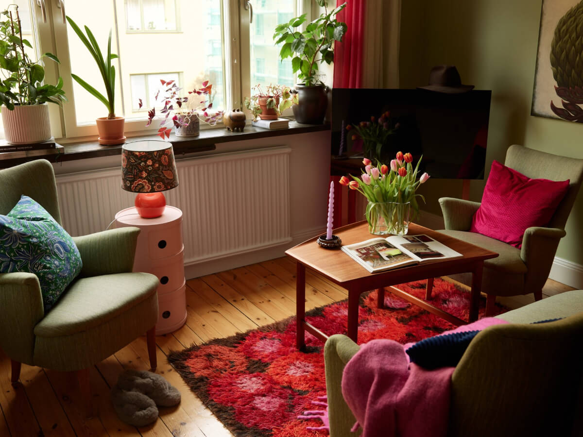 A Colorful Studio Apartment with Smart Storage and A Cozy Bed Niche 1 studio apartment sitting area wooden floor