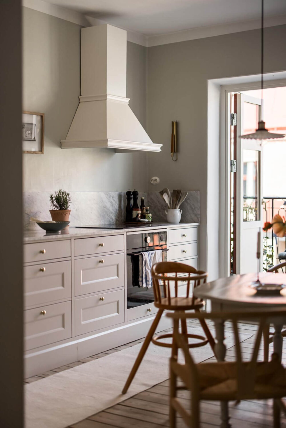 Gray Tones and a Classic Kitchen in a Swedish Apartment 15 view into kitchen