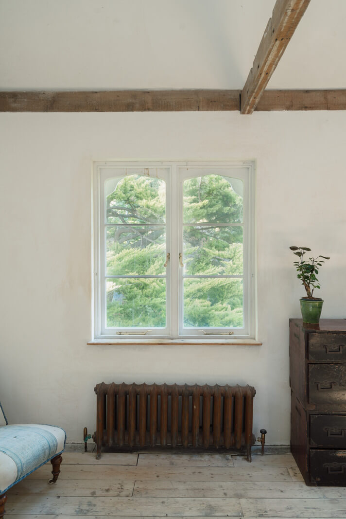 Grand, Light-Filled Spaces in a Gothic-Style English Coastal Home 16 bedroom window