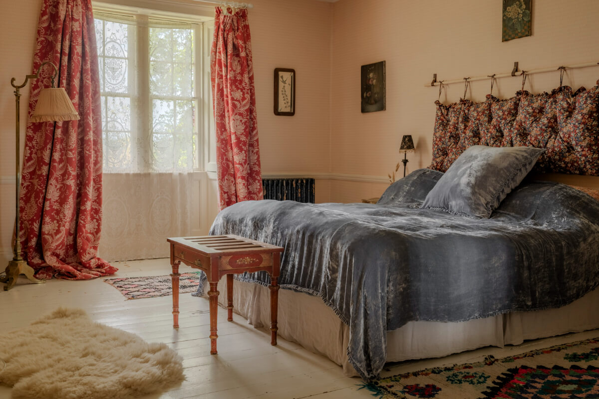 Pearl Lowe and Danny Goffey’s Eclectic Gothic Somerset Home Is For Sale 16 beige pink walls bedroom white floorboards