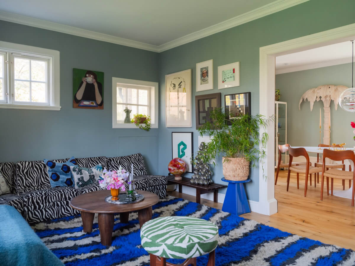 An Early 20th-Century Family Home Decorated with Color and Art 1 cozy living room large corner sofa blue rug