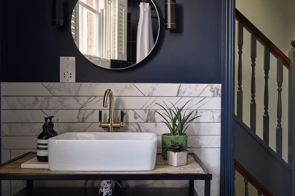 Moody Tones in a Restored and Extended Victorian Home in London 26 dark blue bathroom marble tiles
