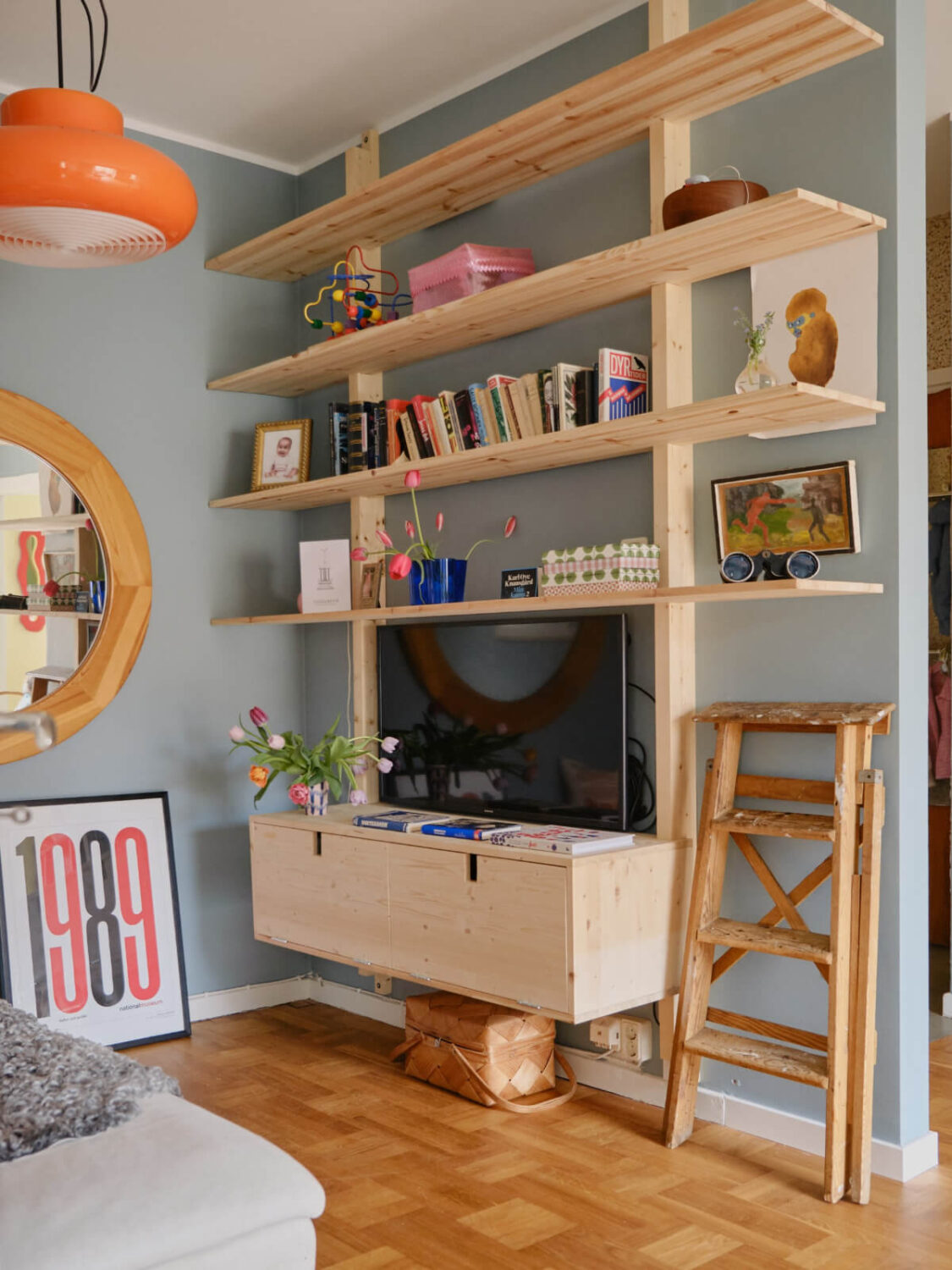 A Colorful 1940s Apartment with Original Elements 1 diy wooden tv cabinets and shelves