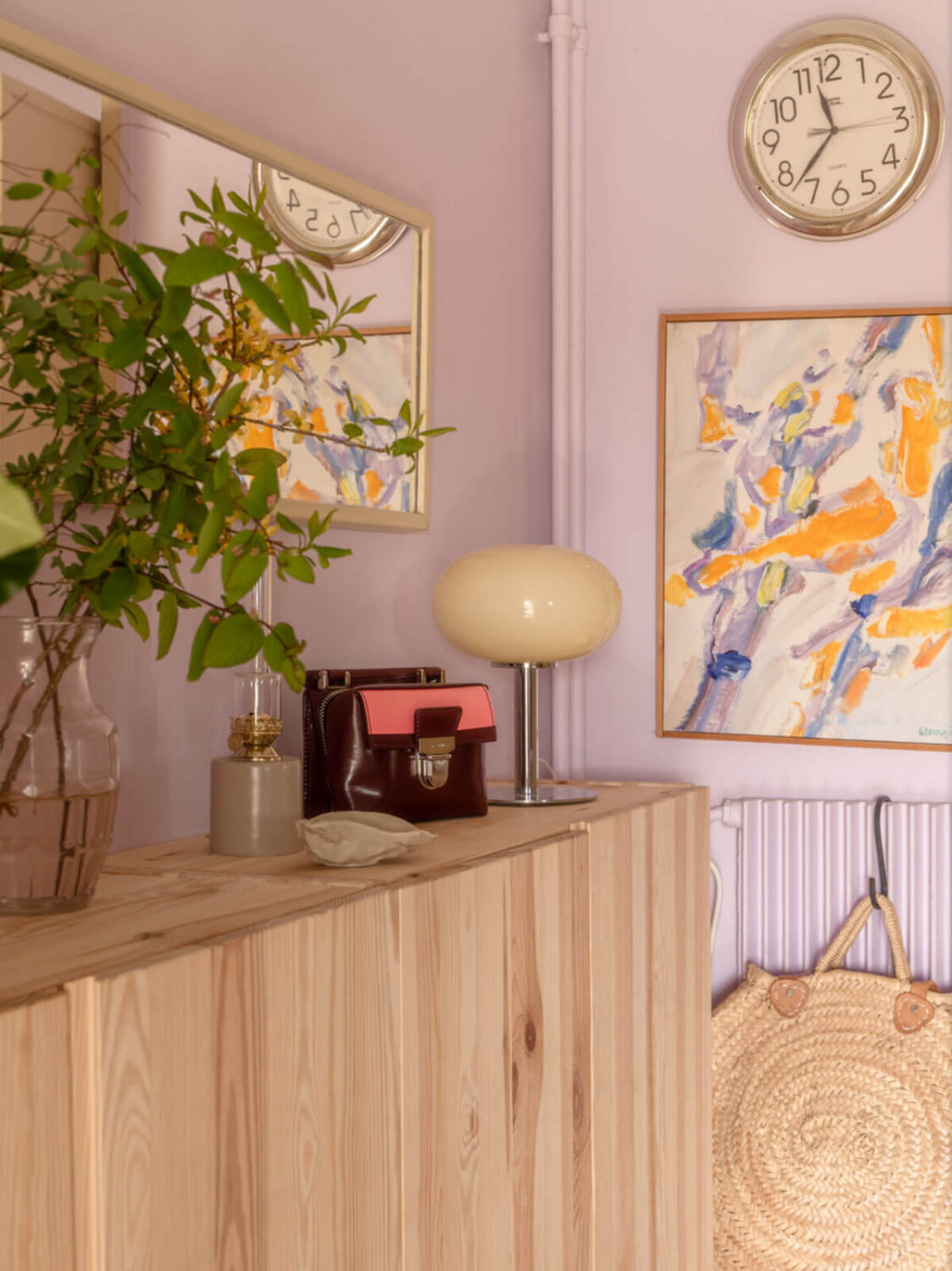 A Stylish and Joyful Color and Material Palette in a Midcentury Apartment 22 lavender walls hall ikea ivar cabinets