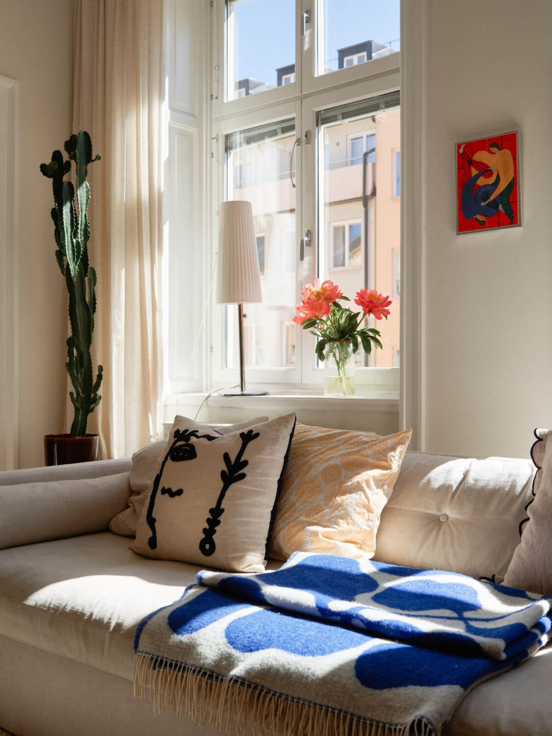 A Light-Filled Stockholm Apartment with Bright Color Pops 5 living room detail