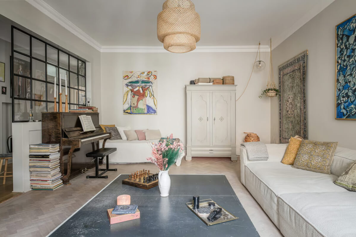 A Spacious One-Bedroom Apartment in Gothenburg 1 living room herringbone floor piano industrial window nordroom