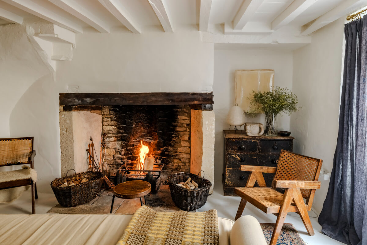 White-Washed Walls and Rustic Elements in a 17th Century Townhouse 1 living room large fireplace white-washed stone walls