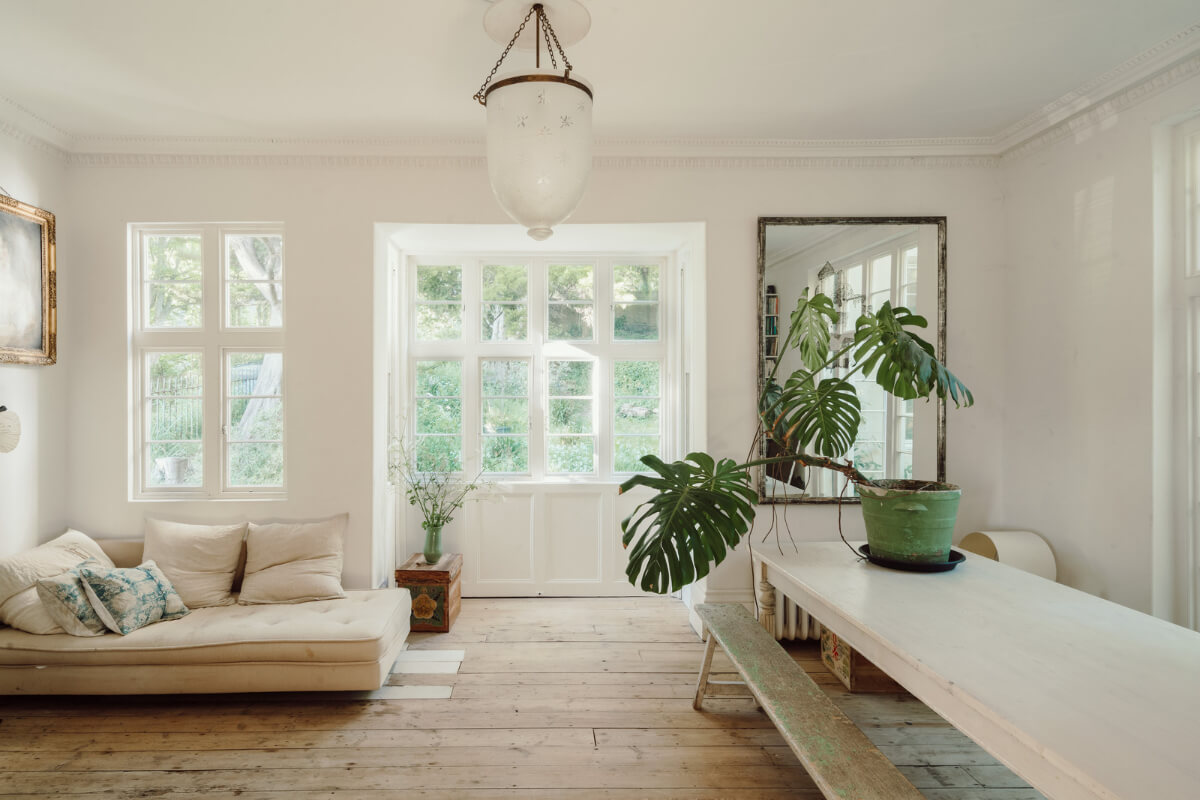 Grand, Light-Filled Spaces in a Gothic-Style English Coastal Home 2 living room wooden floorboards large table