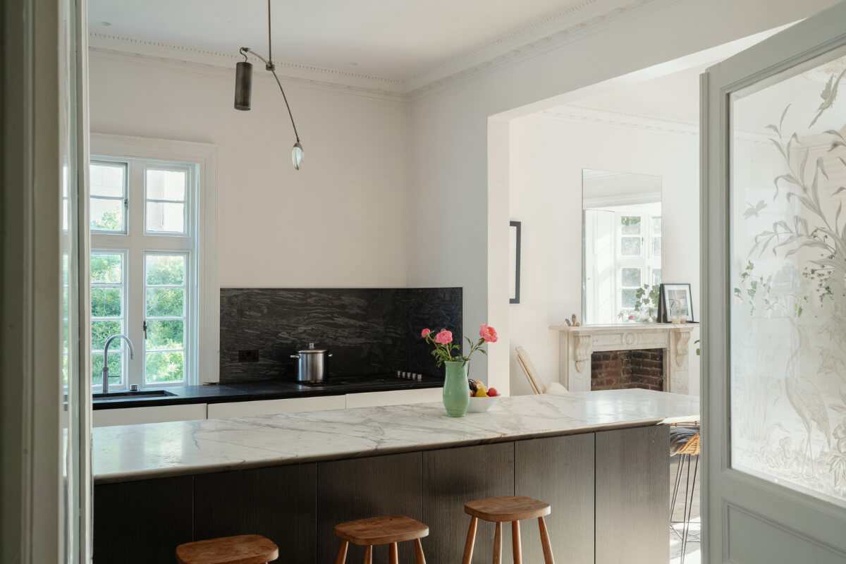 Grand, Light-Filled Spaces in a Gothic-Style English Coastal Home 7 modern kitchen marble countertop