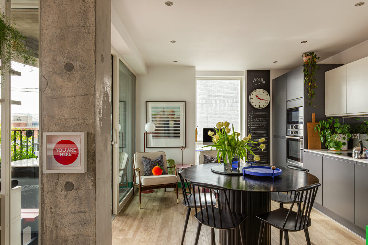 Playful Colors in a Modern One-Bedroom Apartment in London 8 modern kitchen round dining table