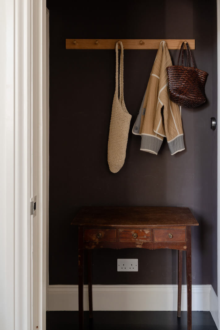 Contemporary and Classic Design in a Two-Bedroom London Duplex 21 moody dark gray hall