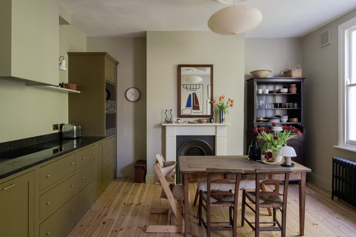 Contemporary and Classic Design in a Two-Bedroom London Duplex 5 olive green kitchen dining area