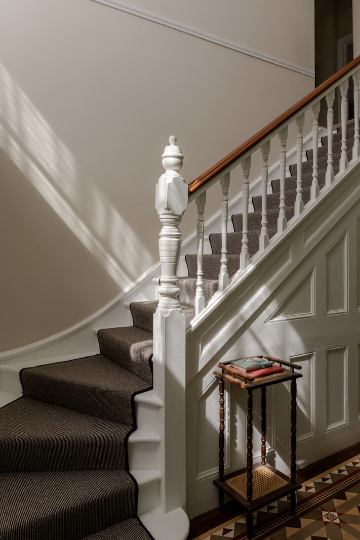 A Grand Edwardian Villa with a Yellow Kitchen and Coastal Views 19 staircase