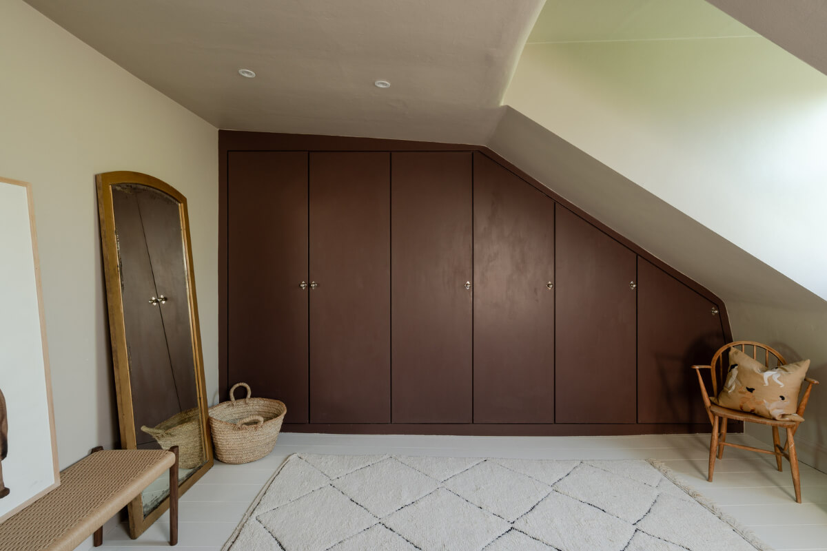 Contemporary and Classic Design in a Two-Bedroom London Duplex 15 wardrobes under slanted ceiling