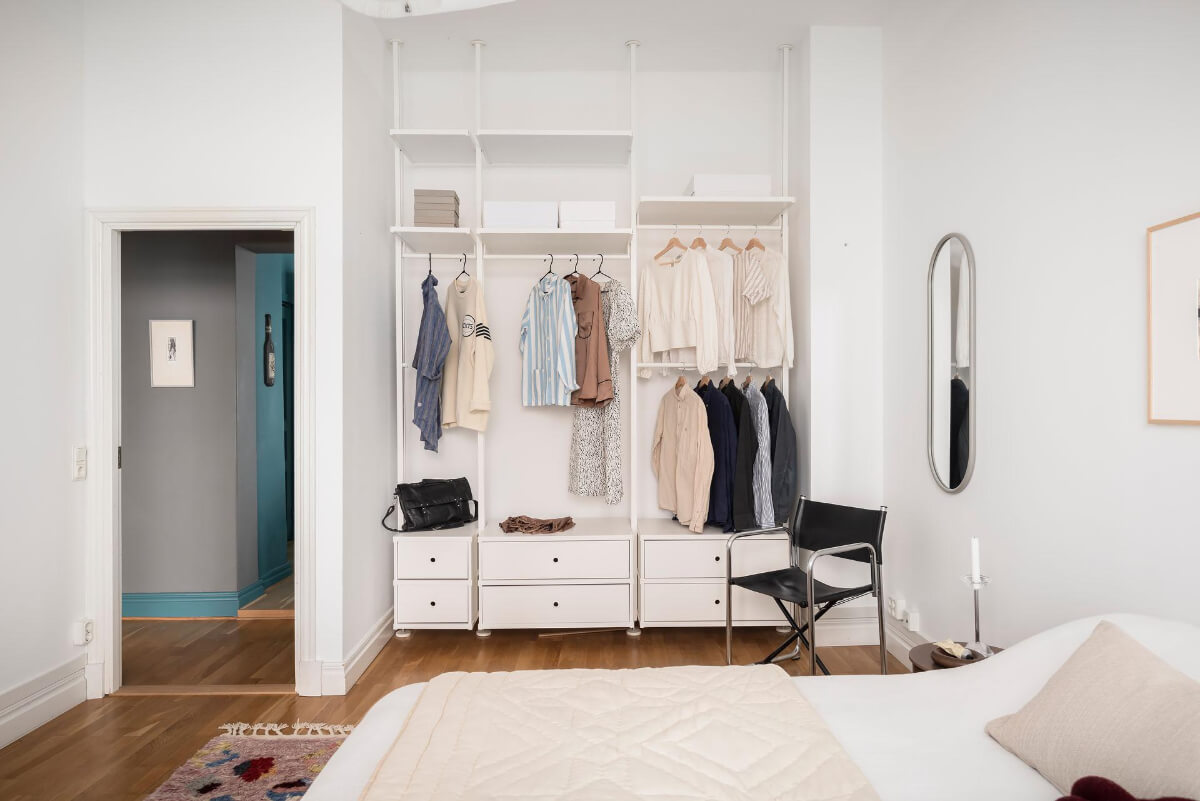 A Teal Green Living Room and Large Windows in a Swedish Apartment 19 white bedroom open wardrobes