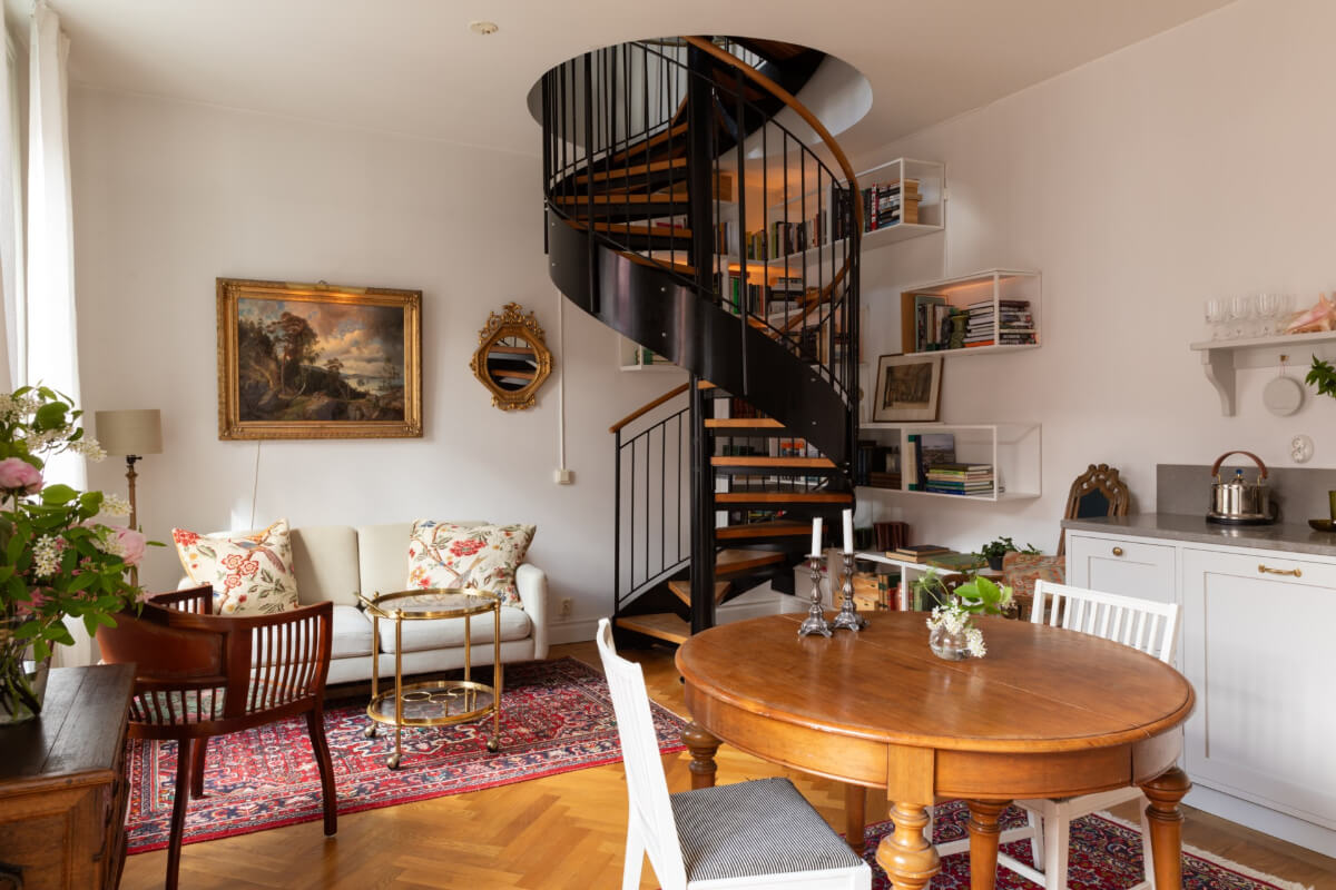 Antiques and Modern Additions in a Cozy Top Floor Duplex Apartment 1 classic open plan living space spiral staircase