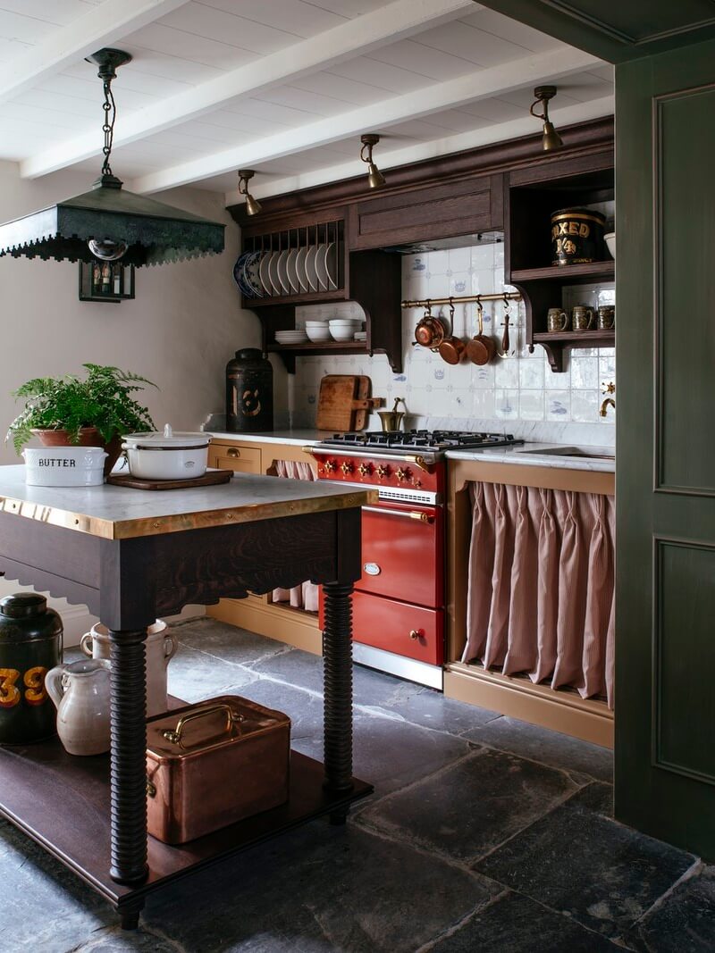 Bespoke Interiors and an Earthy Color Palette in a Historic Cottage 6 cottage kitchen with island marble countertops flagstone floor