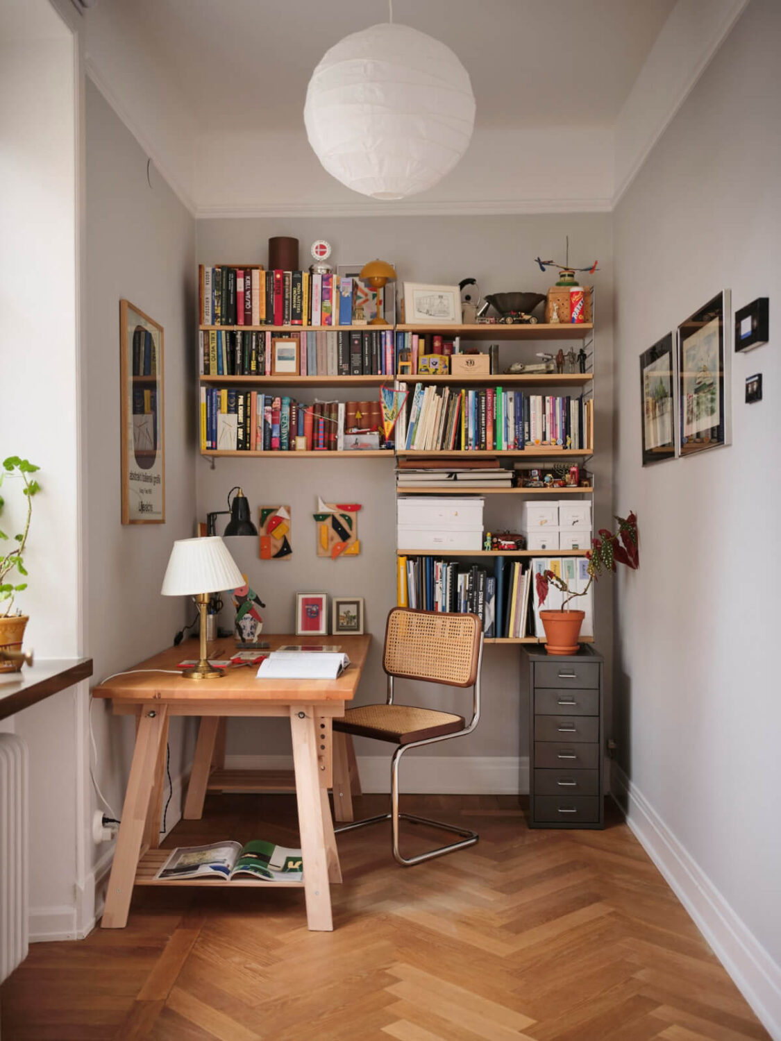An Early 20th Century Apartment with a Muted Green Kitchen 11 home office wooden desk bookshelves
