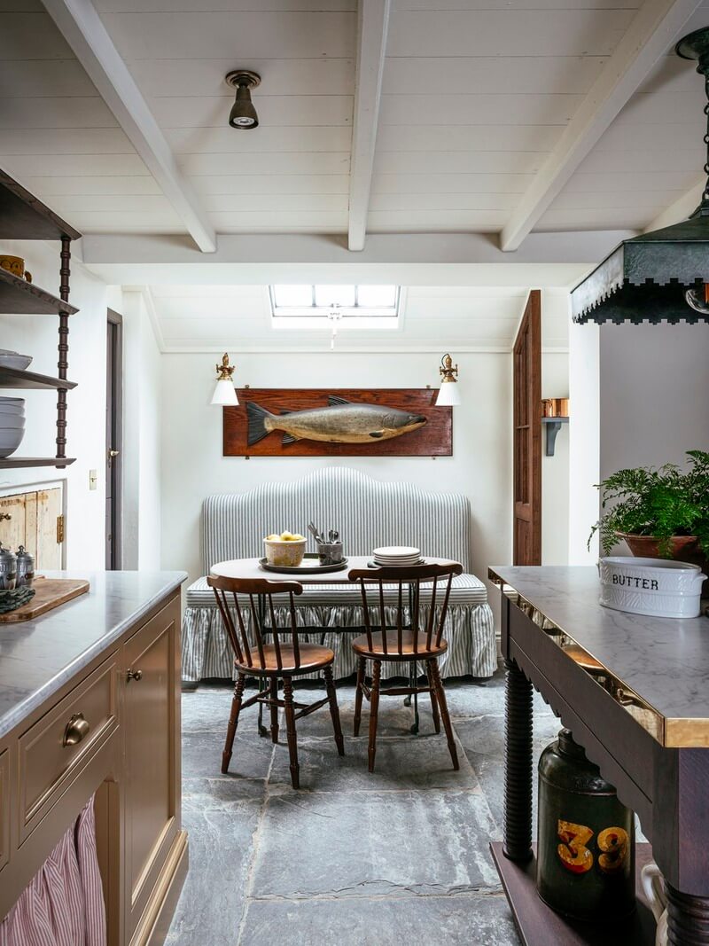 Bespoke Interiors and an Earthy Color Palette in a Historic Cottage 11 kitchen dining area with striped upholstered bench