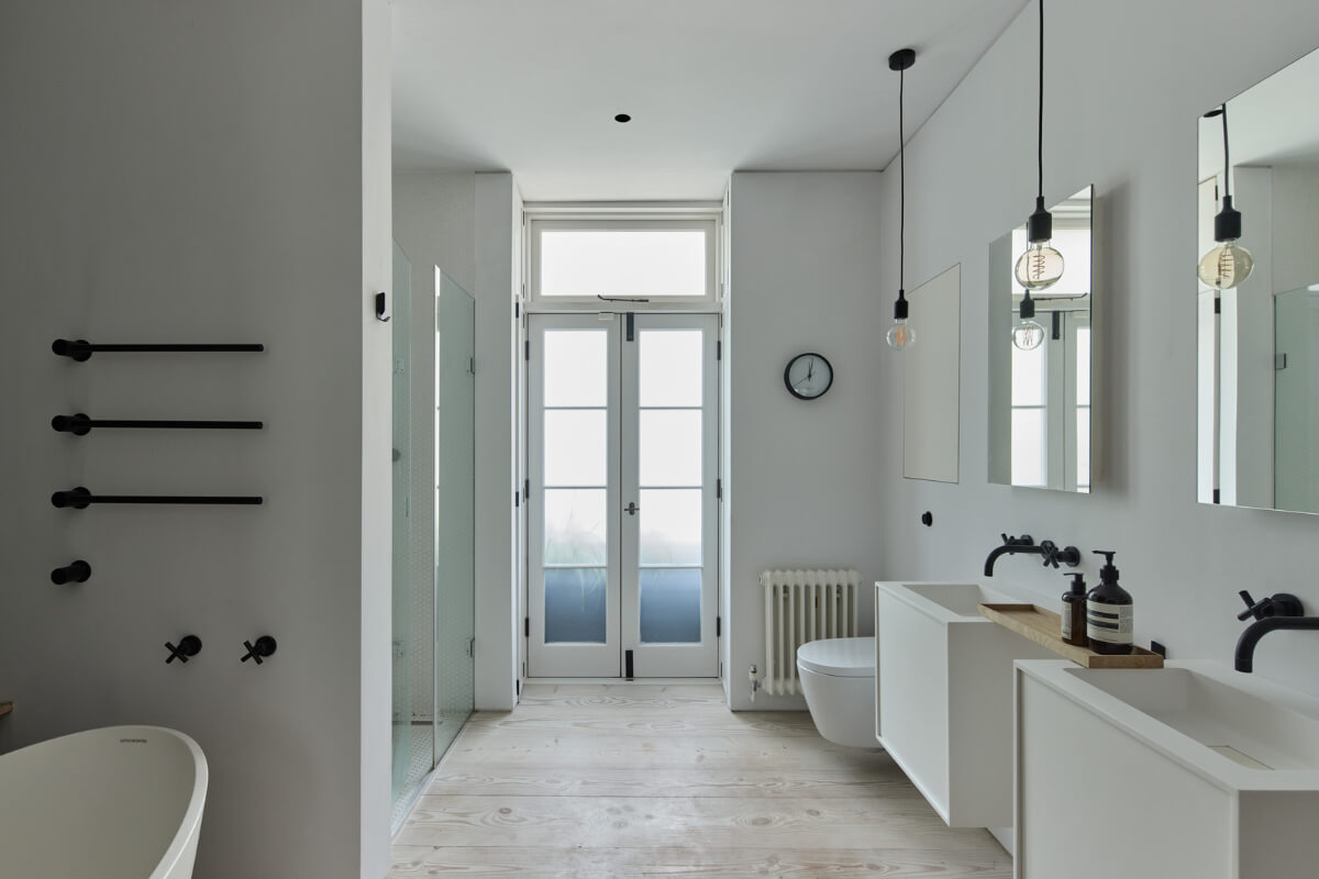 A Black and White Primrose Hill Mews House with a Roof Terrace 13 large white bathroom wooden floor