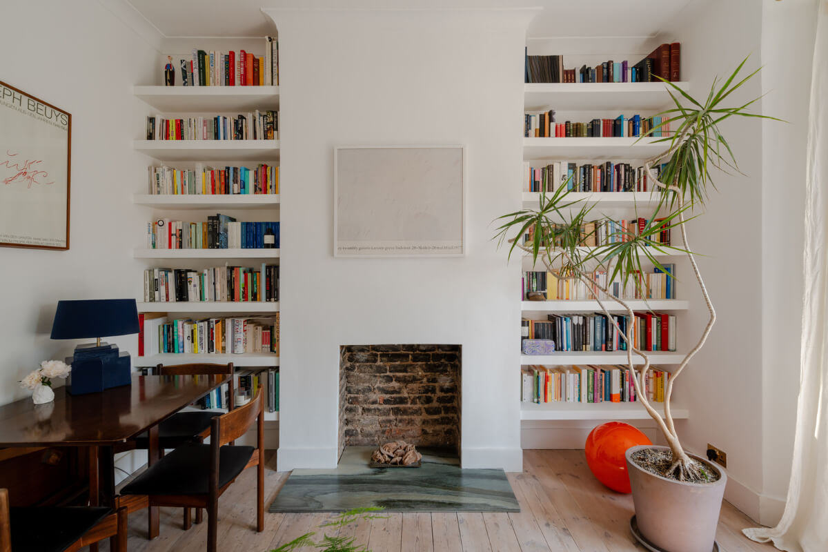 A Bright Ground Floor Apartment with a Beautiful Garden 1 living room brick fireplace bookshelves