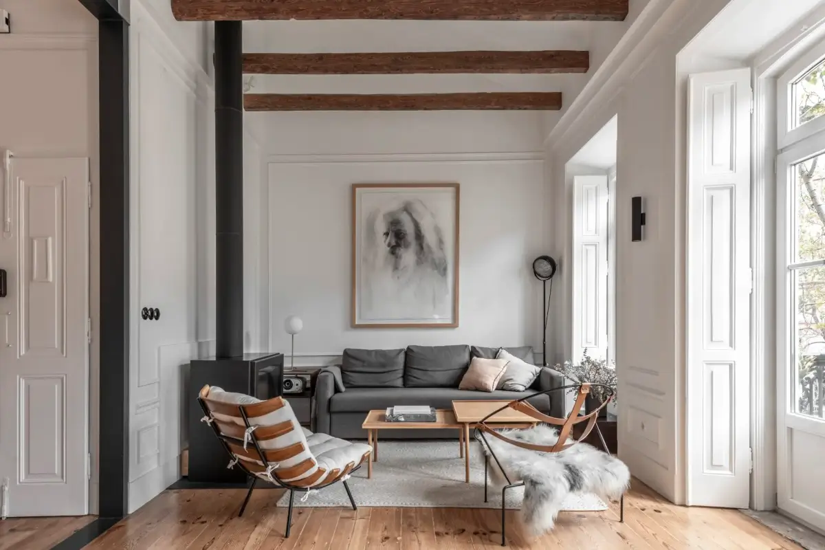 A Light-Filled Duplex Apartment in a Classical Lisbon Building 1 living room wood burner wooden beams
