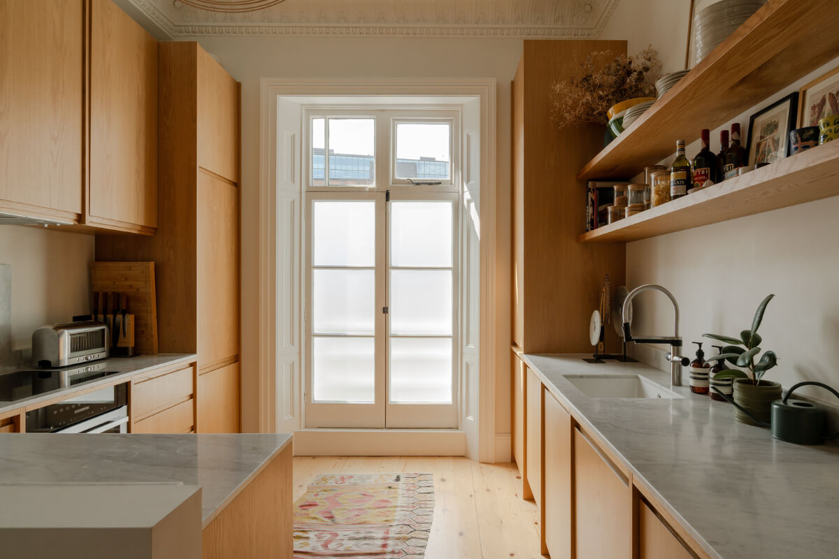 Historic Charm and Modern Design in a Light-Filled Pimlico Apartment 12 oak kitchen cabinets marble countertop Historic Charm and Modern Design in a Light-Filled Pimlico Apartment