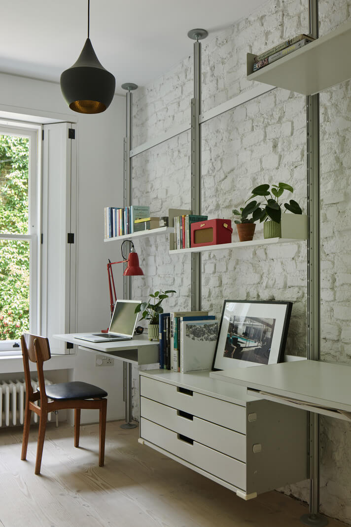 A Black and White Primrose Hill Mews House with a Roof Terrace 16 shelving system with desk brick wall