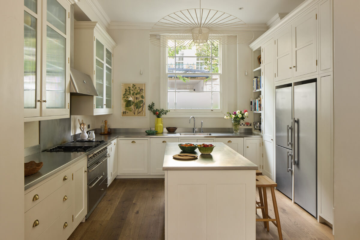 Light-Filled Interiors in a Grand Early Victorian House in Notting Hill 1 white kitchen polished stainless steel countertop