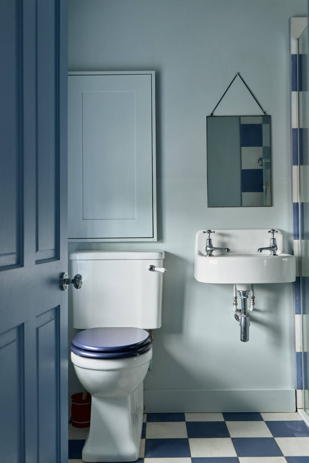 A Colorful Design-Led Georgian House in the Heart of Henley-on-Thames 53 blue bathroom with checkerboard tiles