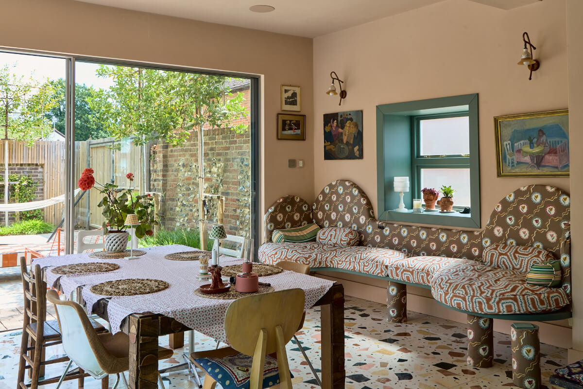 A Colorful Design-Led Georgian House in the Heart of Henley-on-Thames 6 dining space with curved built-in bench