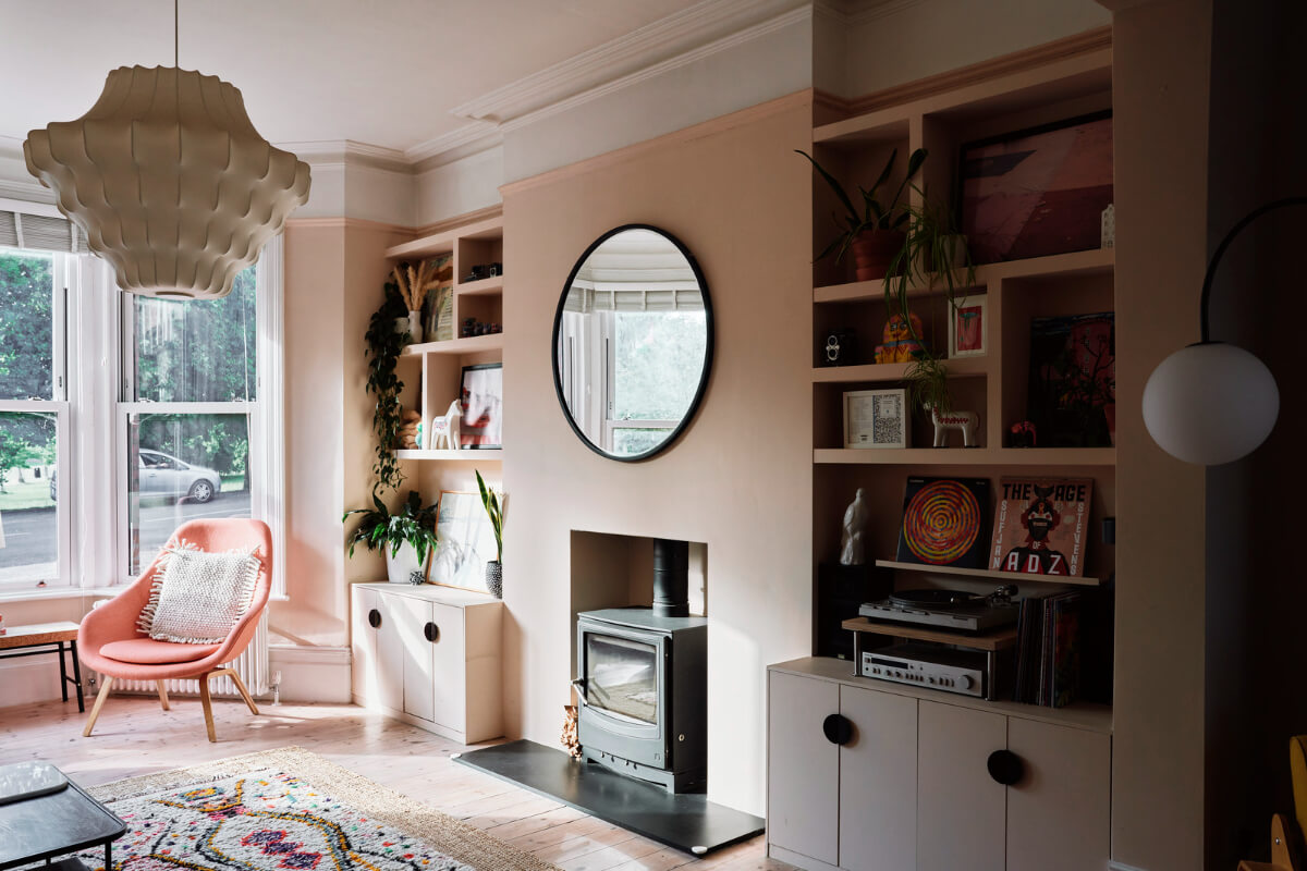Colorful Rooms and a Modern Kitchen in a Spacious Family Home 2 pink living room fireplace built-in shelves