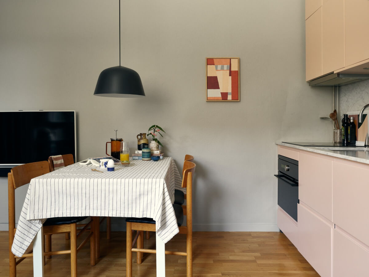 A Tiny Apartment with a Semi-Open Floorplan and a Pink Kitchen 11 small kitchen dining table