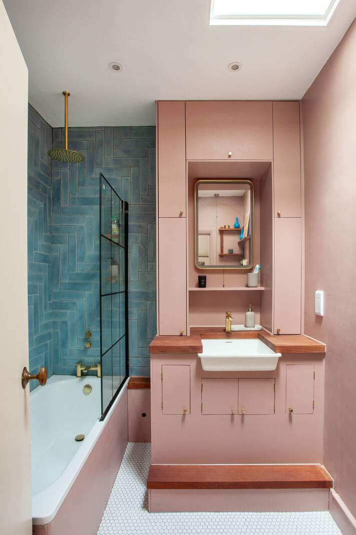 Pastel Tones and Midcentury Design in a Top Floor London Apartment 17 small pink and blue bathroom with bath