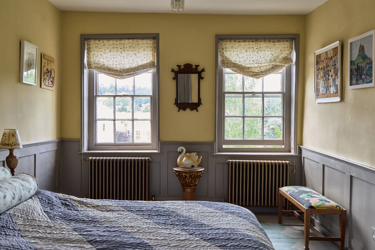 A Colorful Design-Led Georgian House in the Heart of Henley-on-Thames 55 yellow bedroom gray paneling