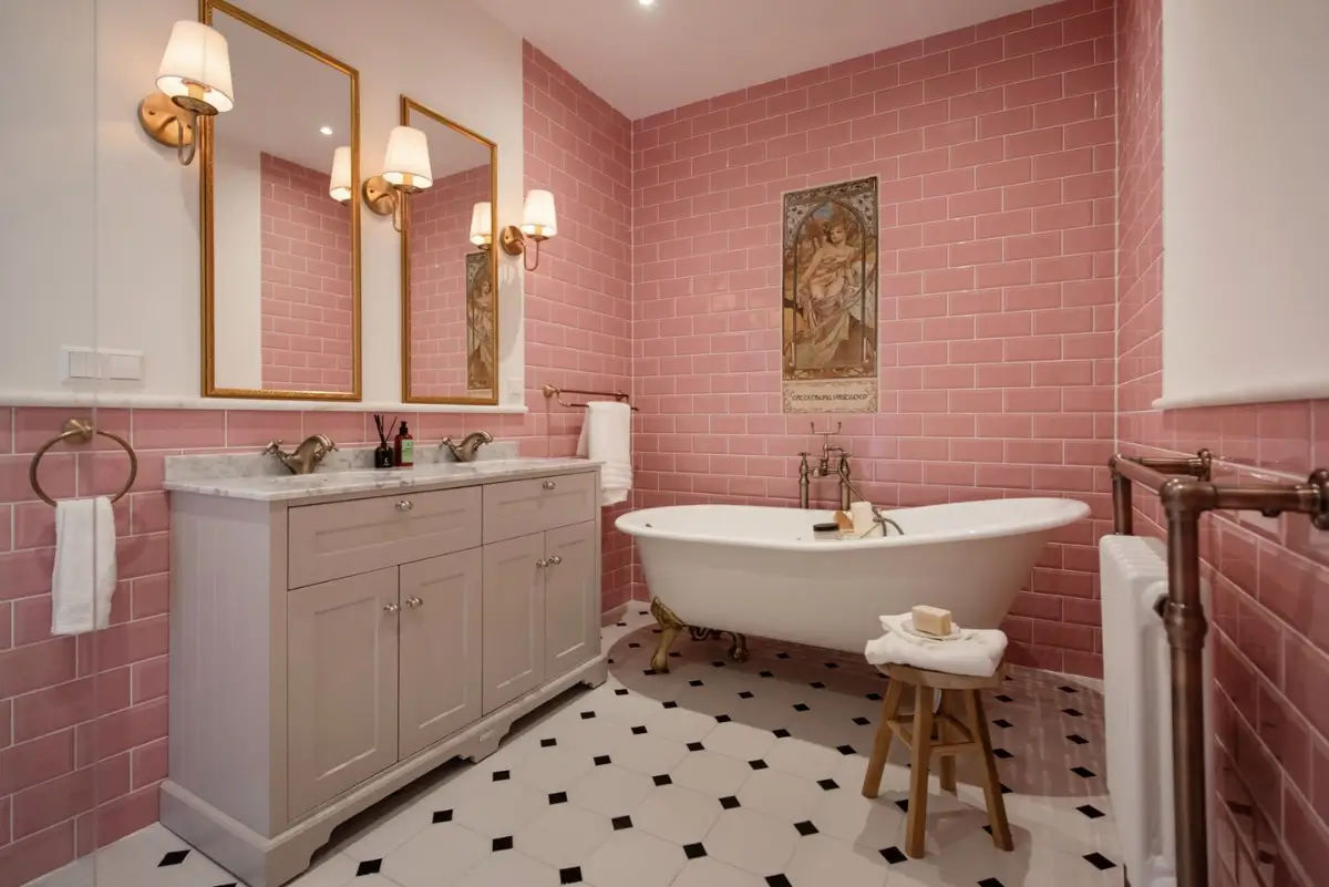 Art Nouveau Elegance Meets Modern Living in a Pink & Green Apartment 22 bathroom pink tiles freestanding bath double sink marble top