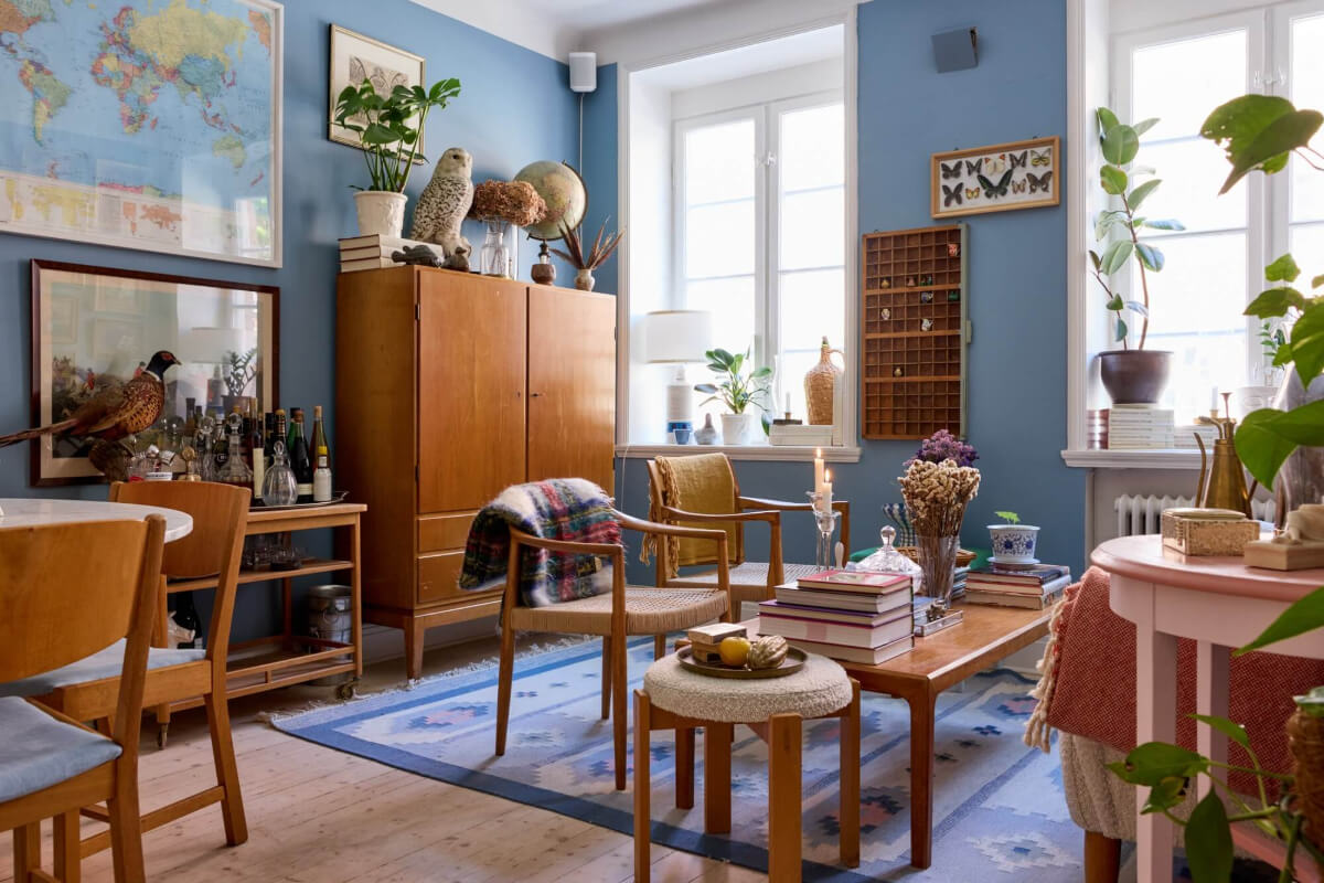 A Blue Living Room Filled with Art in a Swedish Apartment 1 blue living room vintage furniture