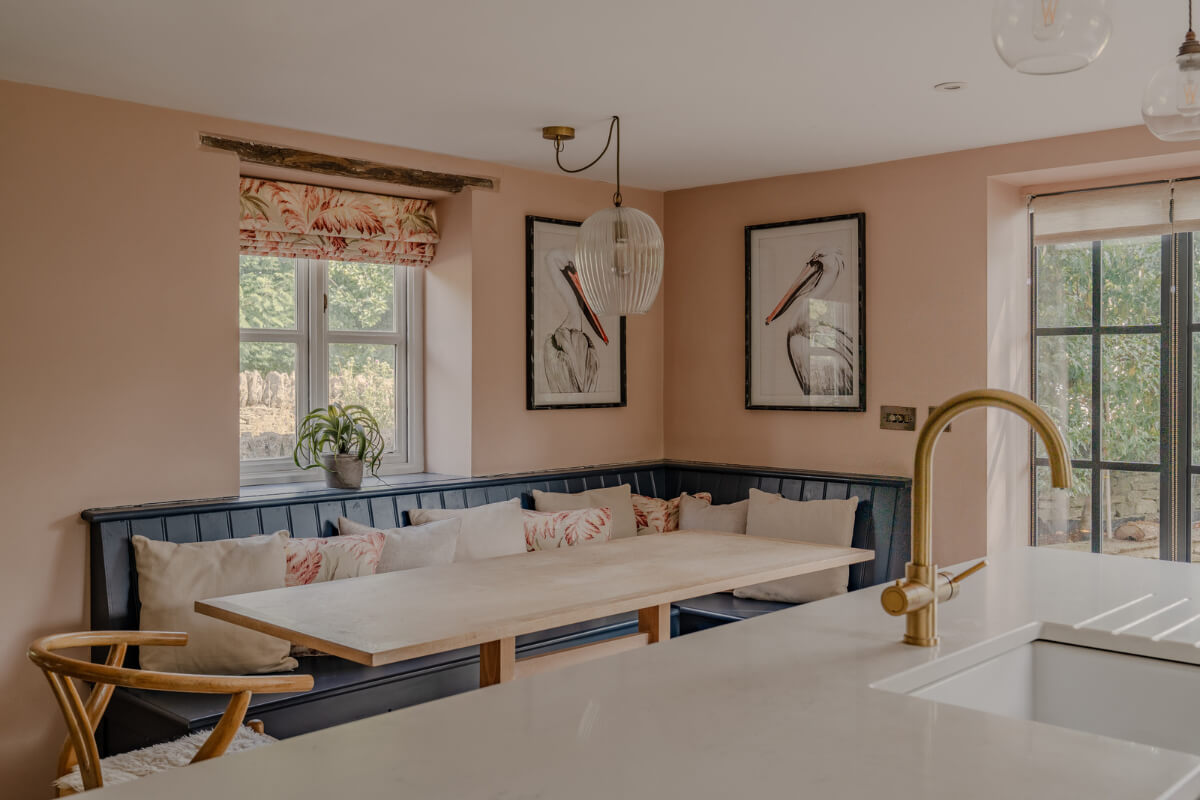A Stone English Cottage with a Blue and Pink Kitchen 3 kitchen table with built-in banquette