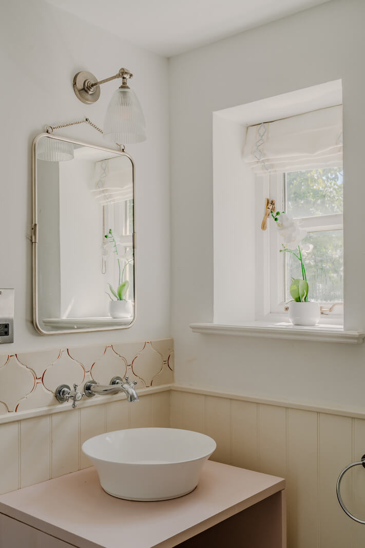 A Stone English Cottage with a Blue and Pink Kitchen 17 light cottage bathroom paneling