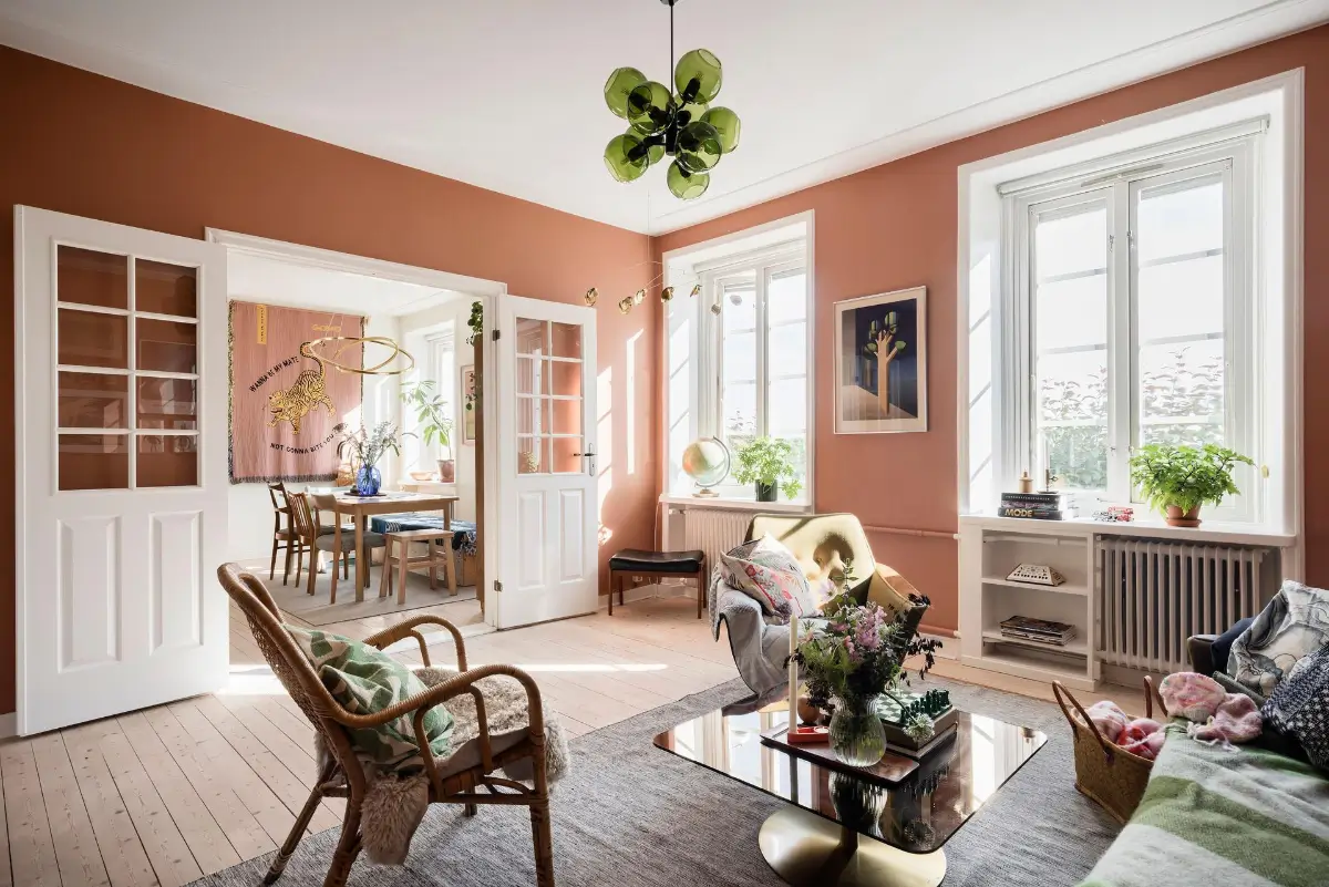A Colorful 1920s Family Apartment in Sweden 1 living room wooden floor terracotta walls deep window niches
