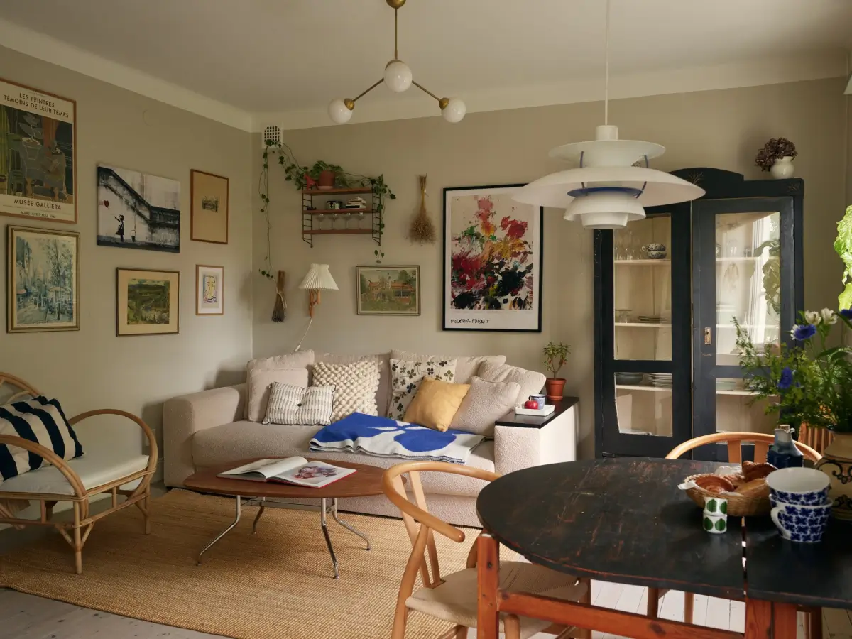 A Muted Color Palette in a Cozy 1920s Apartment in Stockholm 1 neutral scandinavian living room with art nordroom