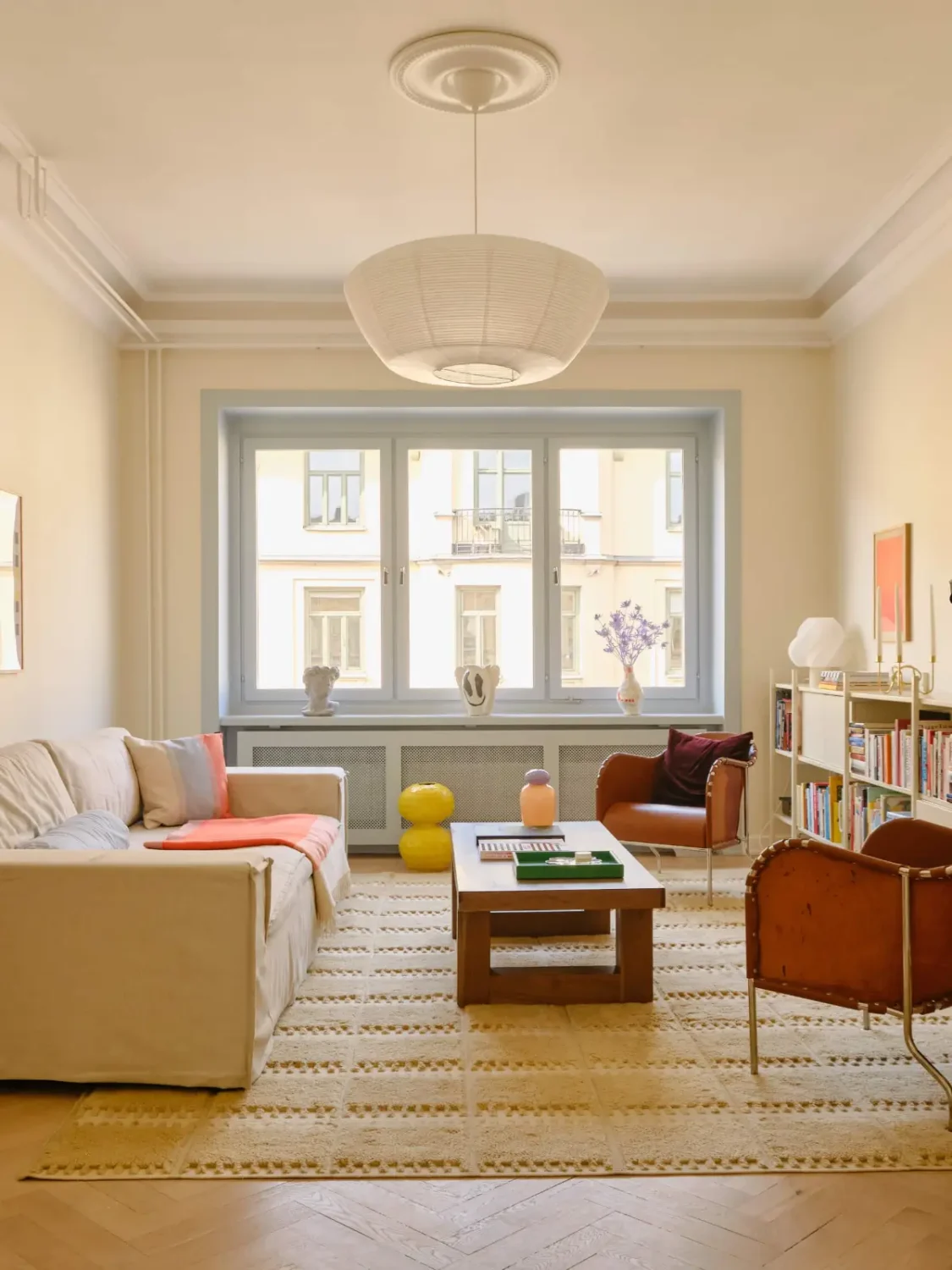 Pastel Hues in a Light-Filled 1880s Apartment in Stockholm 1 scandi living room beige walls pastel blue window frames nordroom