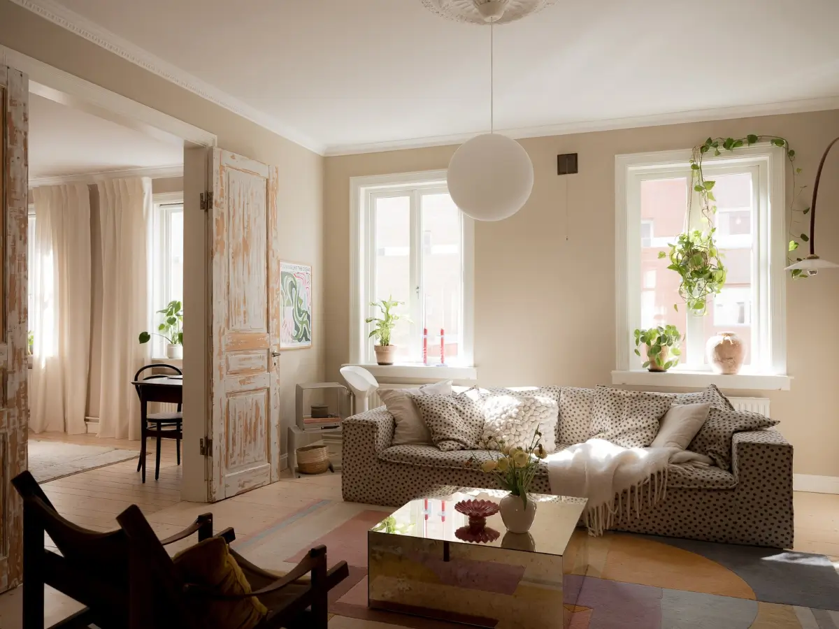 Neutral Shades and Period Elements in a Scandi Apartment 1 scandi living room sand-colored walls polkadot sofa