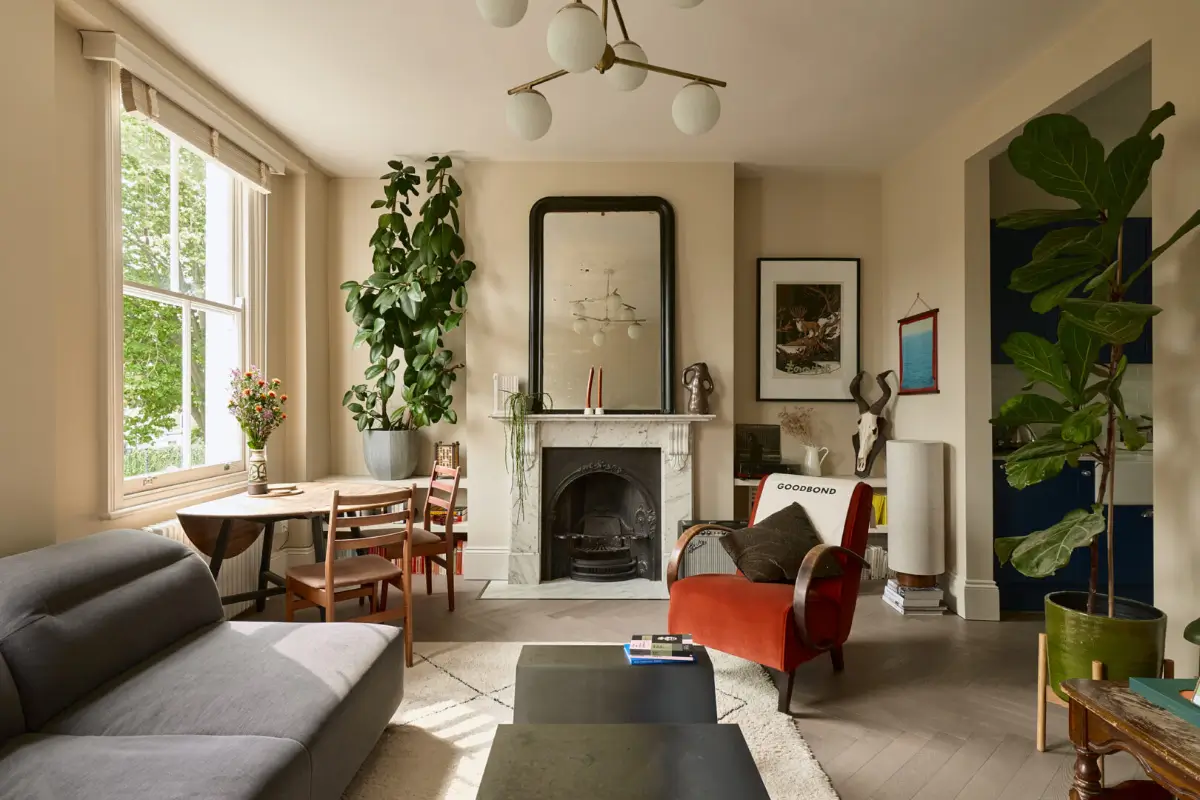 A Classic Victorian Duplex with a Lush, Private Garden in London 1 serene london living room large windows marble firpelace