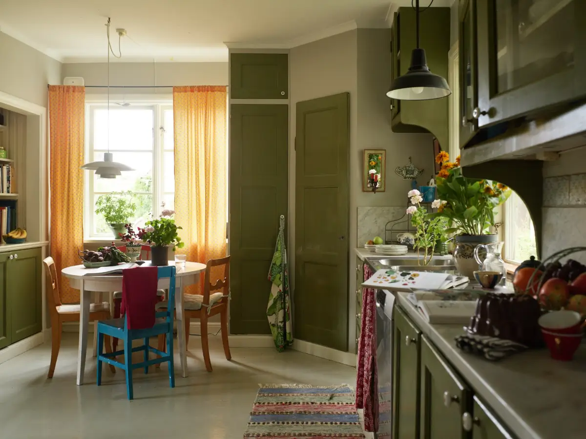 green kitchen with round table