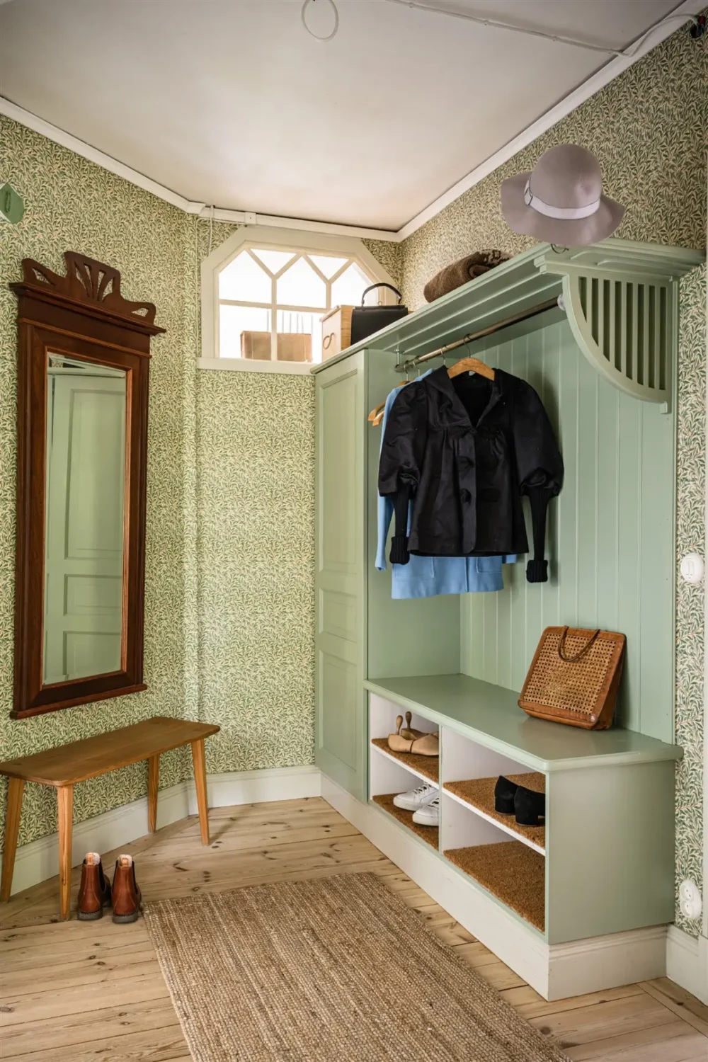 A Cozy Early 20th-Century Home with Views of Lake Mälaren in Sweden 32 hall william morris wallpaper built in storage nordroom A Cozy Early 20th-Century Home with Views of Lake Mälaren in Sweden