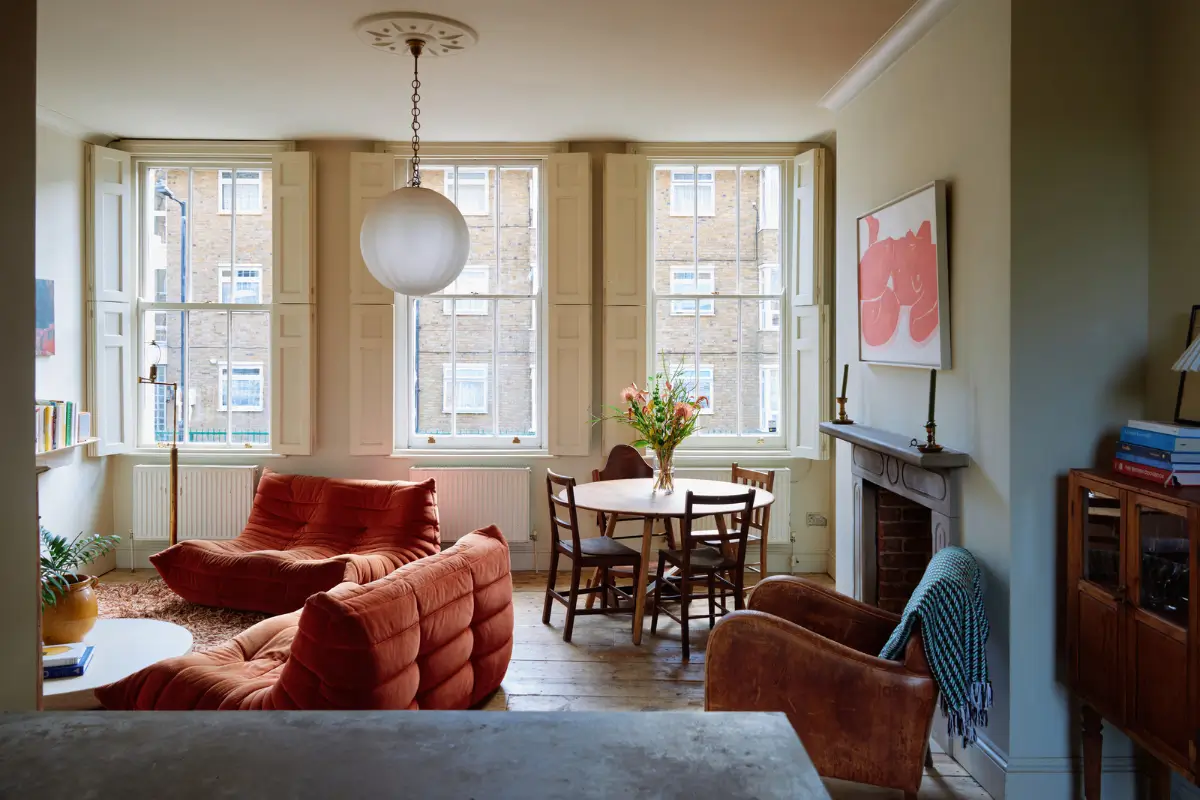 Restored Features in a Charming Georgian Apartment in London 1 living room large windows timber floor terracotta sofa
